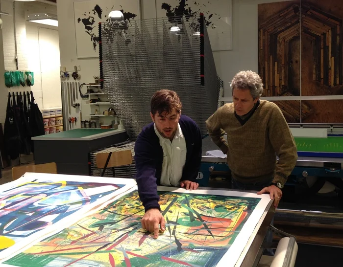 Drew Peterson showing his work to guest critic John Saurer