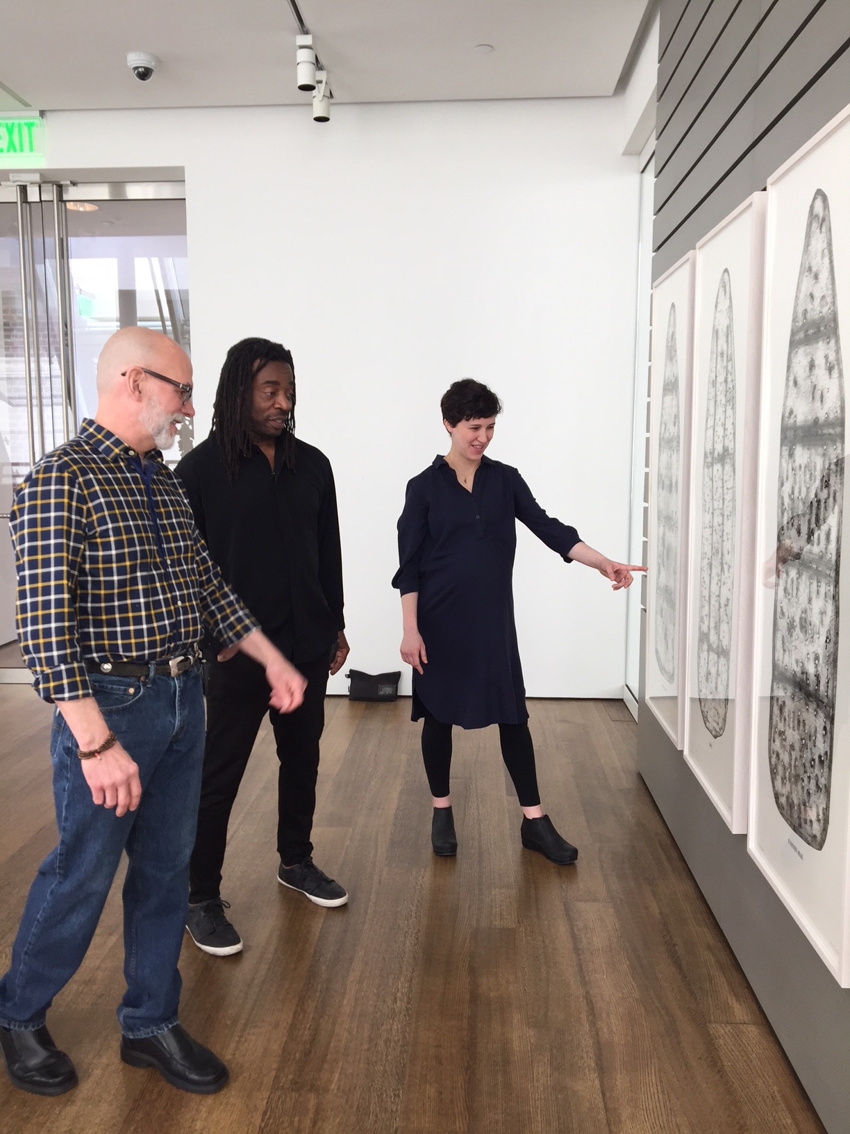  Cole Rogers, artist Willie Cole and Christina Taylor, Assistant Paper Conservator, Straus Center for Conservation and Technical Studies at the Harvard Art Museums discuss The Five Beauties suite. 