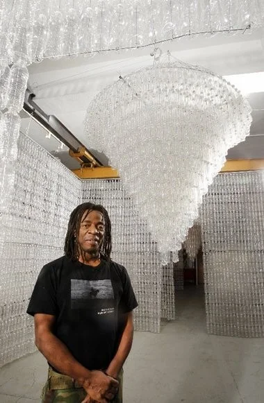 Artist Willie Cole's exhibit "From Water to Light" features two chandeliers in rooms made of recycled water bottles. It runs through May 31 at the Prospect Street Fire Station Gallery in Newark.