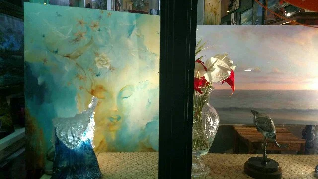 Dina's work in the window at Dreams Of Paradise Gallery on historic Hilo Bay in Hawaii