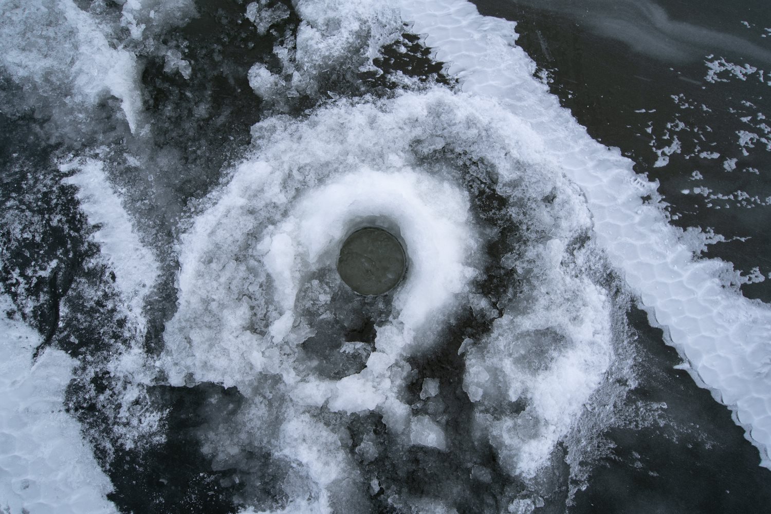 Ice fishing hole.