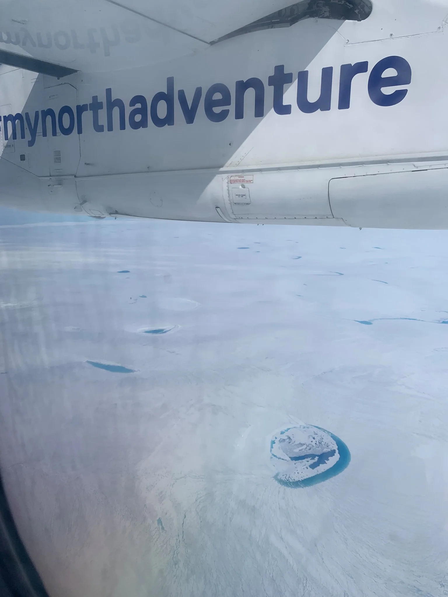 Meltwater on the surface of the ice sheet.