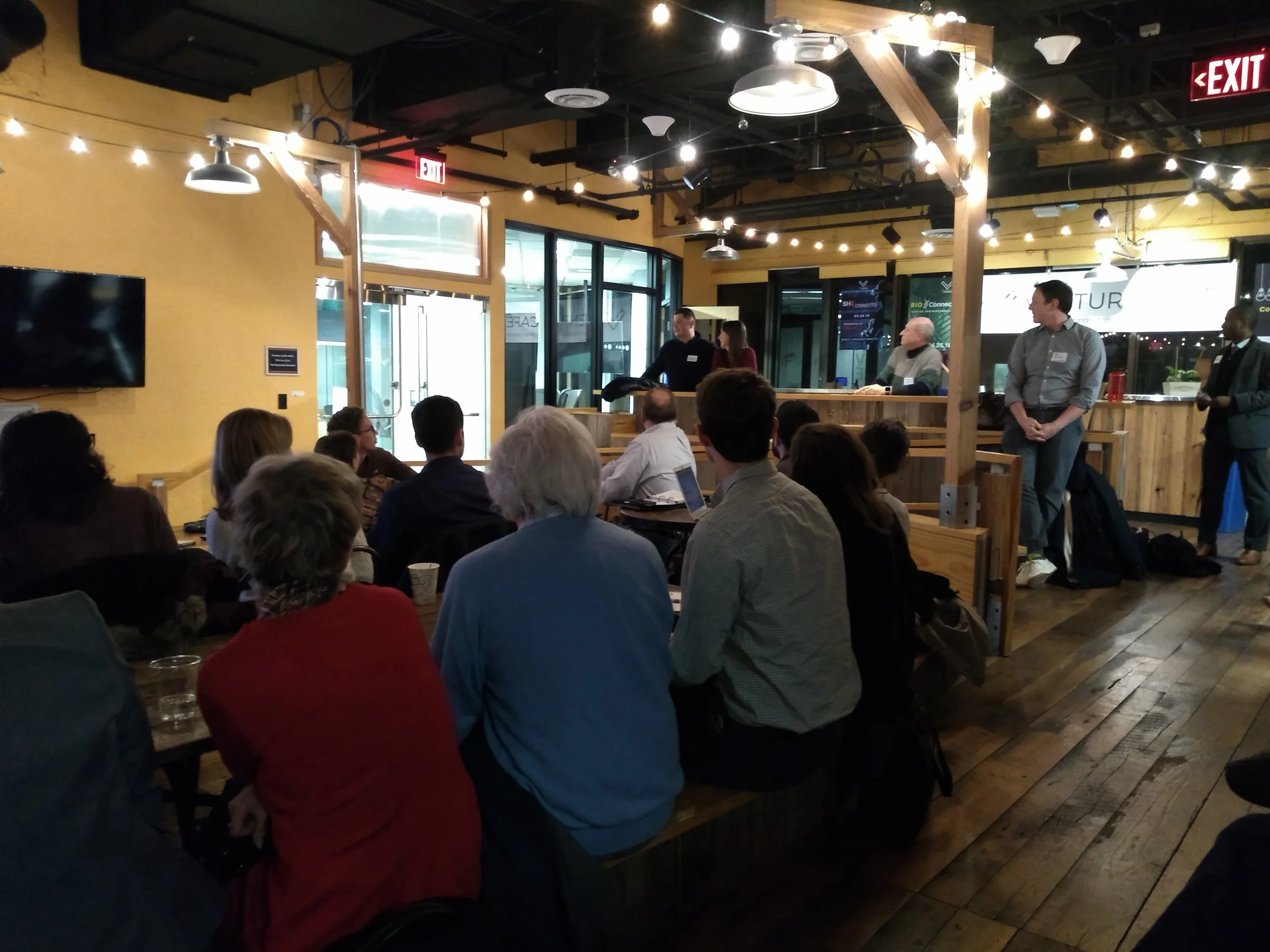 The crowd at “Put Your Money Where It Matters” learning about the difference between impact investing and Socially Responsible Investing (SRI)