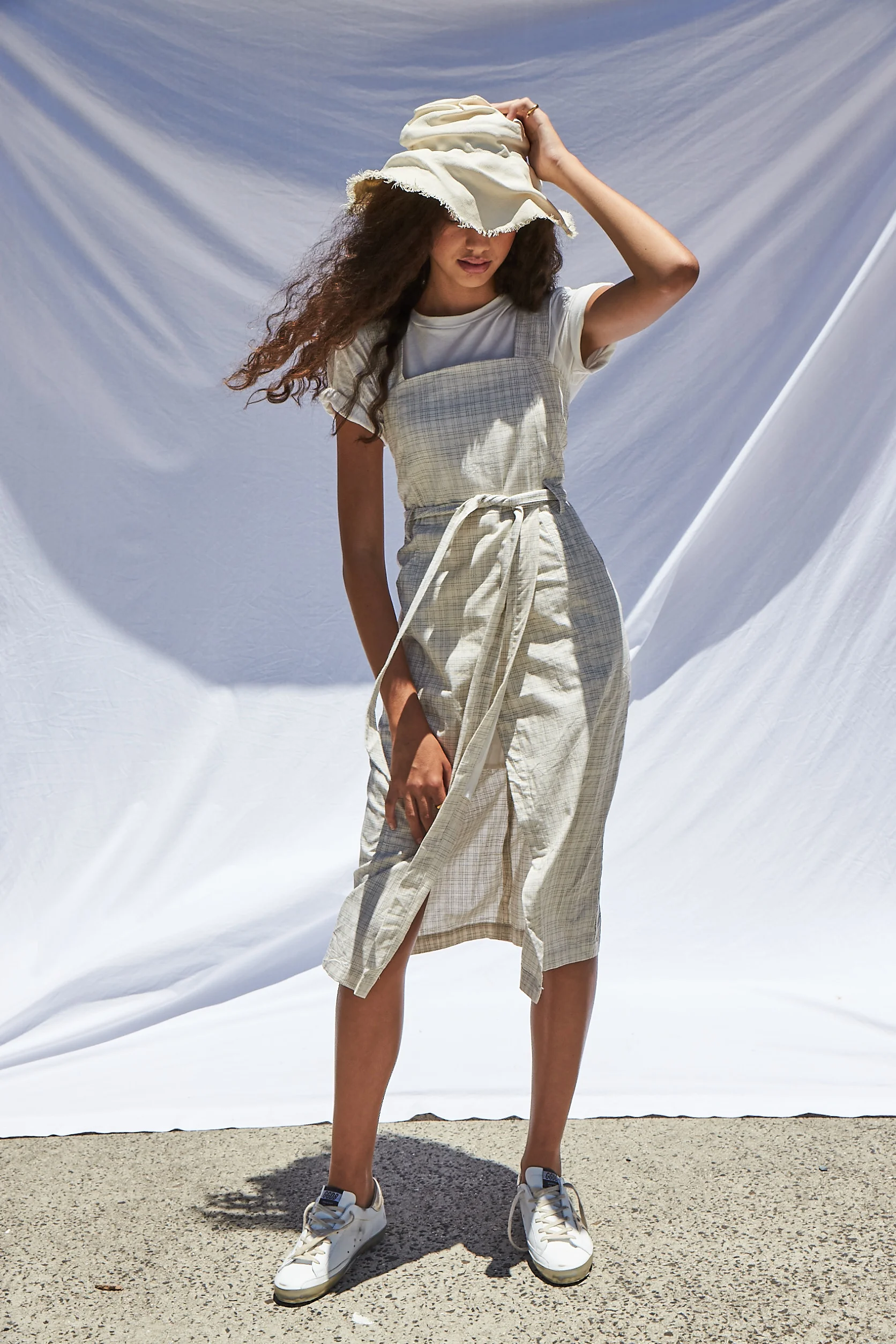 Dress | Interval , T shirt | Thrills Co , Hat + Trainers | Island Luxe
