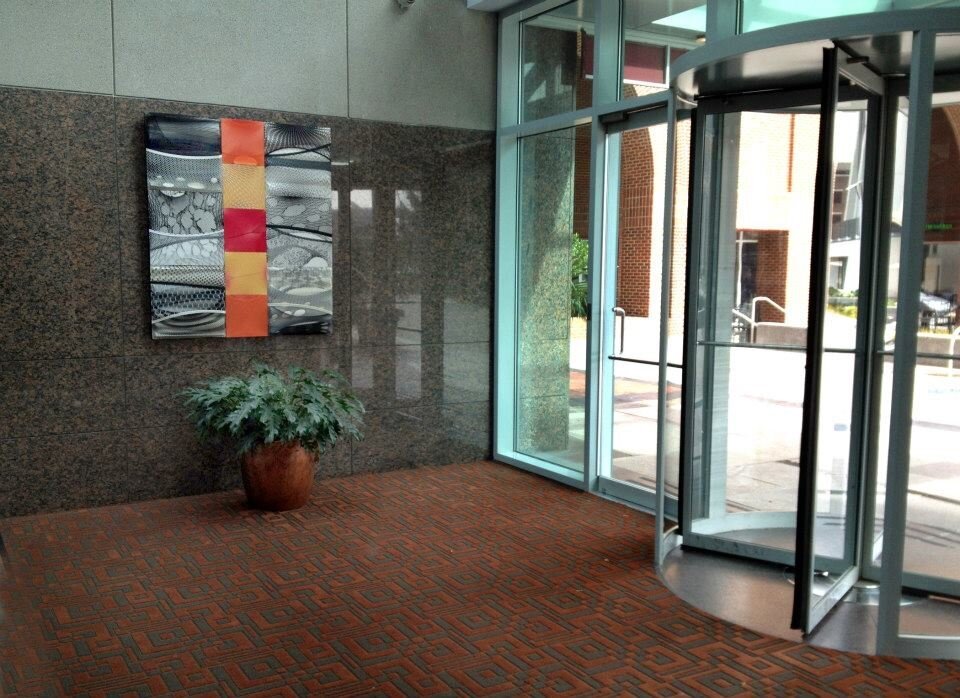  Commissioned by Capital Development for  their  27 story Two Hannover Building in the heart of  downtown Raleigh.  Two fiber works, made from hosiery, paint and cradled boards, greet visitors from the Fayetteville Street entrance. The open two-story