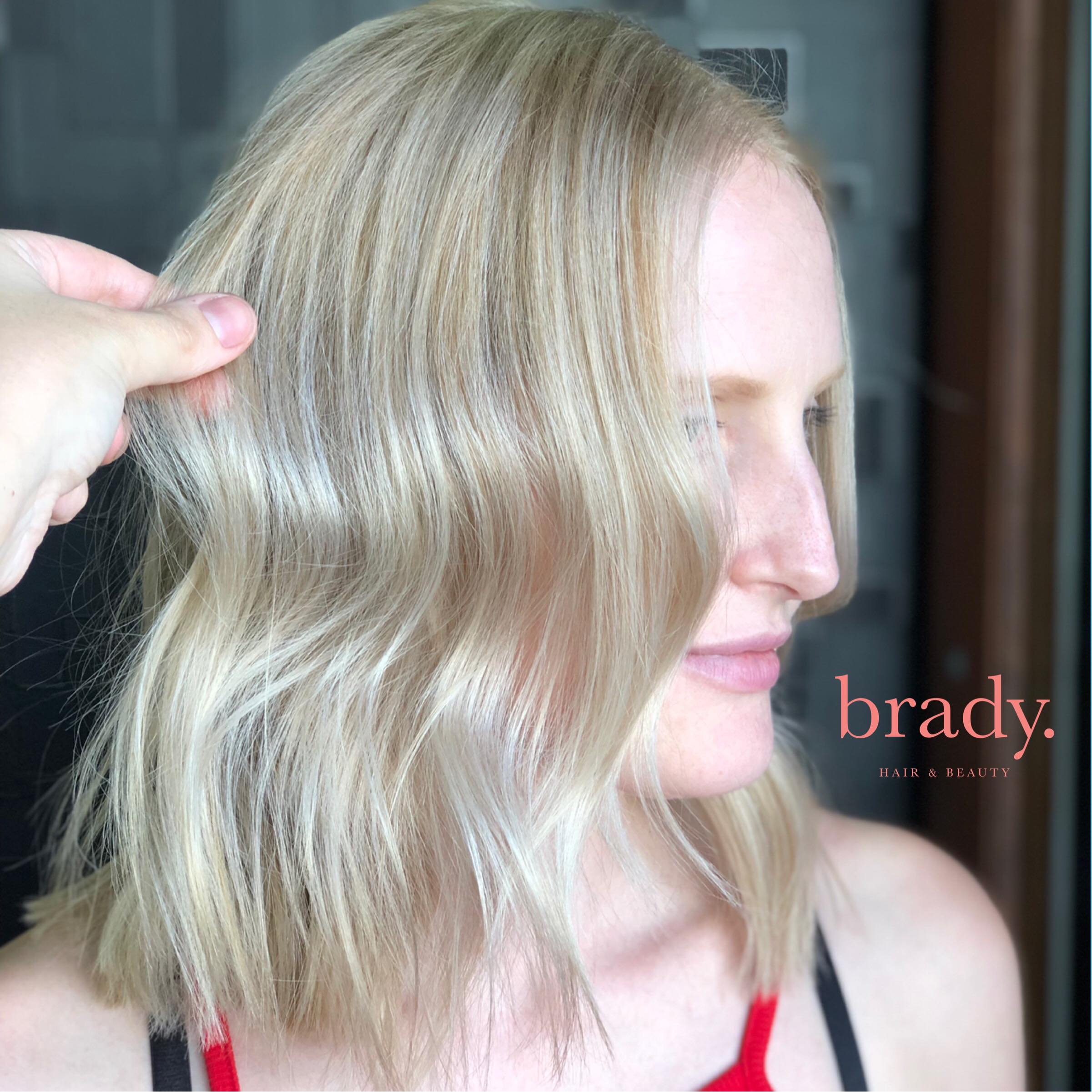  Photo of woman with medium blonde hair with very loose waves. Styled by Brady. Hair &amp; Beauty, Toowong, Brisbane. 
