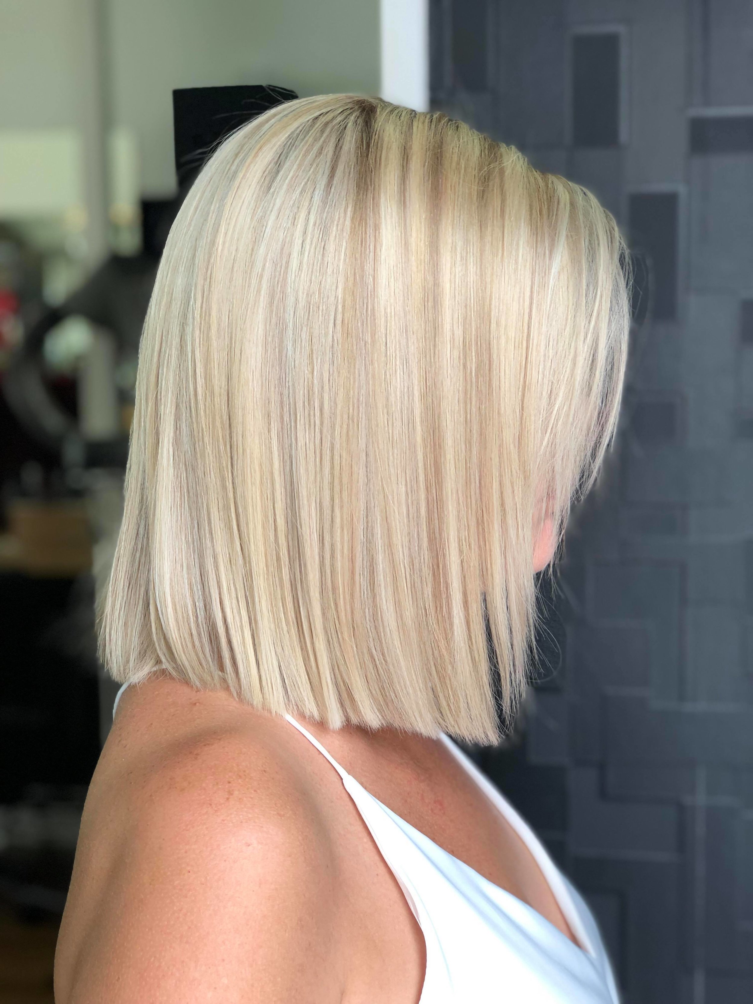  Photo of woman with shoulder length straight blonde hair. Styled by Brady. Hair &amp; Beauty, Toowong, Brisbane. 