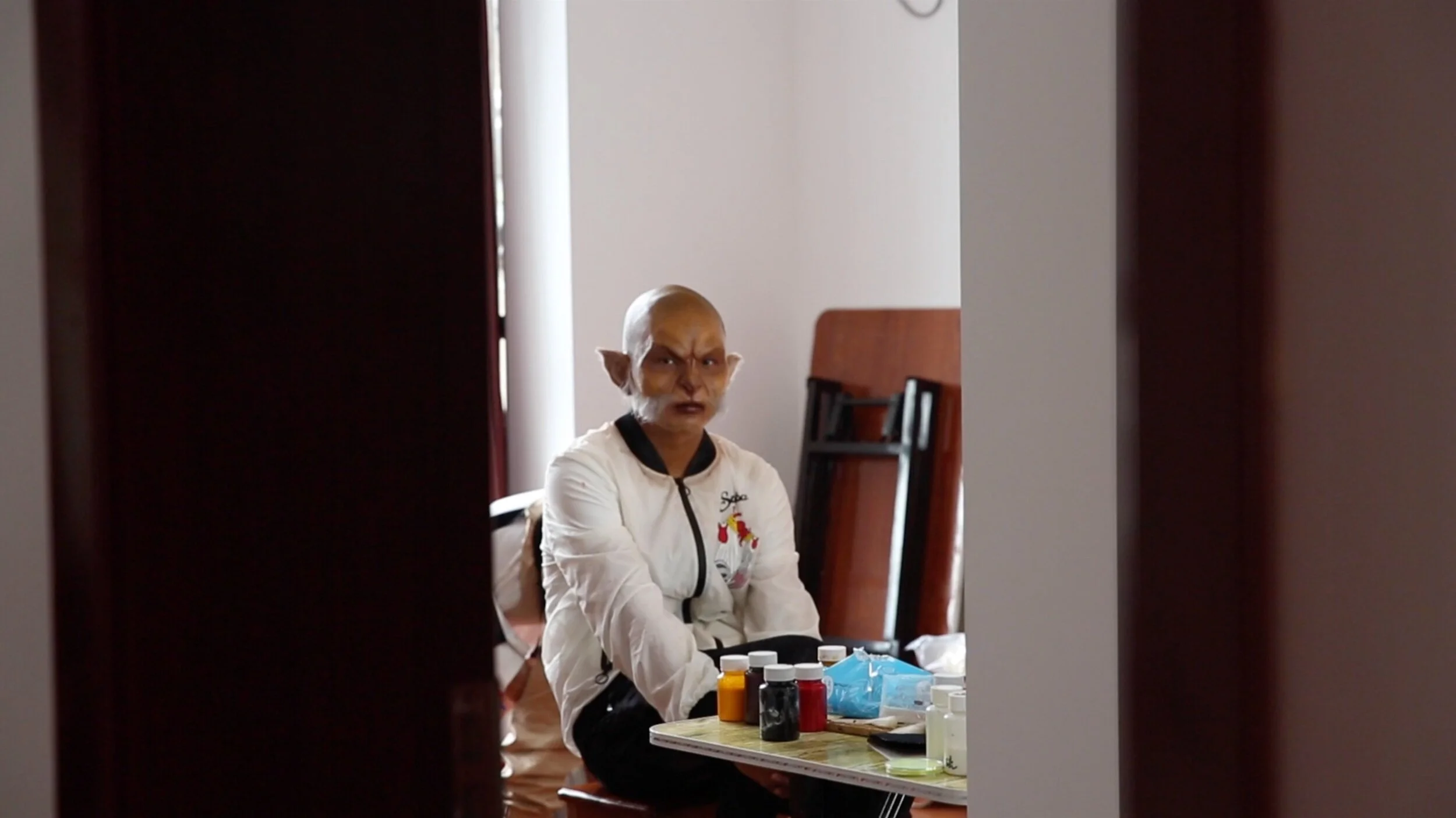  A Background Actor Waiting for Makeups  