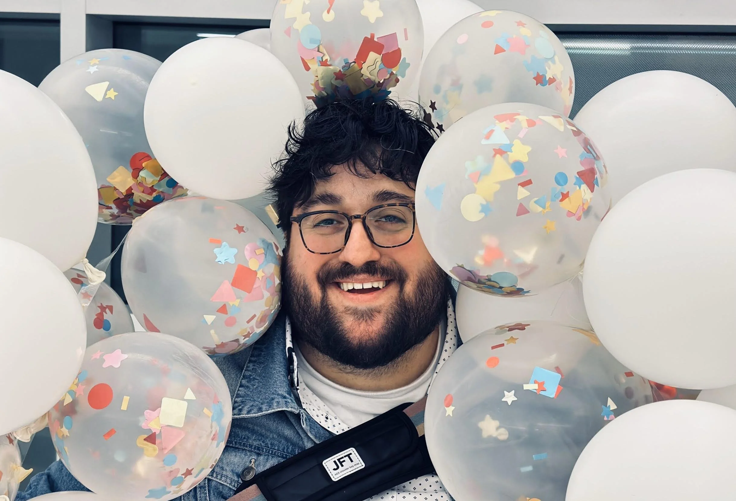 Steven Espada Dawson surrounded by balloons