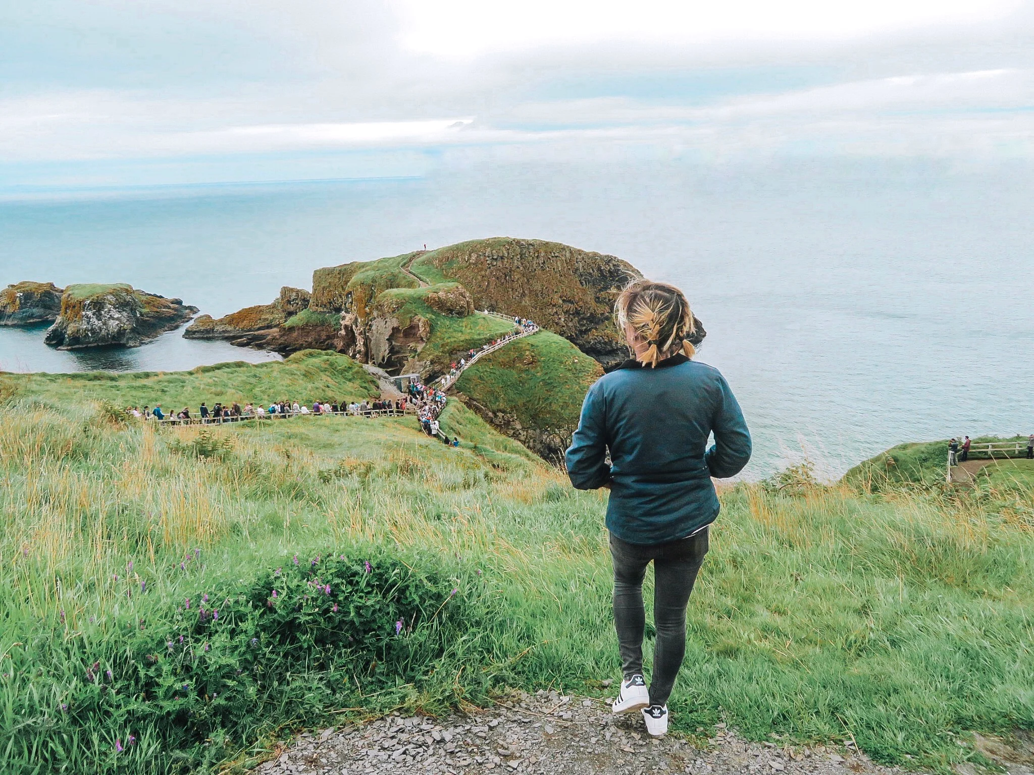 Photo taken at Carrick-a-Rede Bridge, Northern Ireland by a ‘stranger’ I’d met on the bus here. If anything, strangers make great insta-husbands. (credit: nourish music )