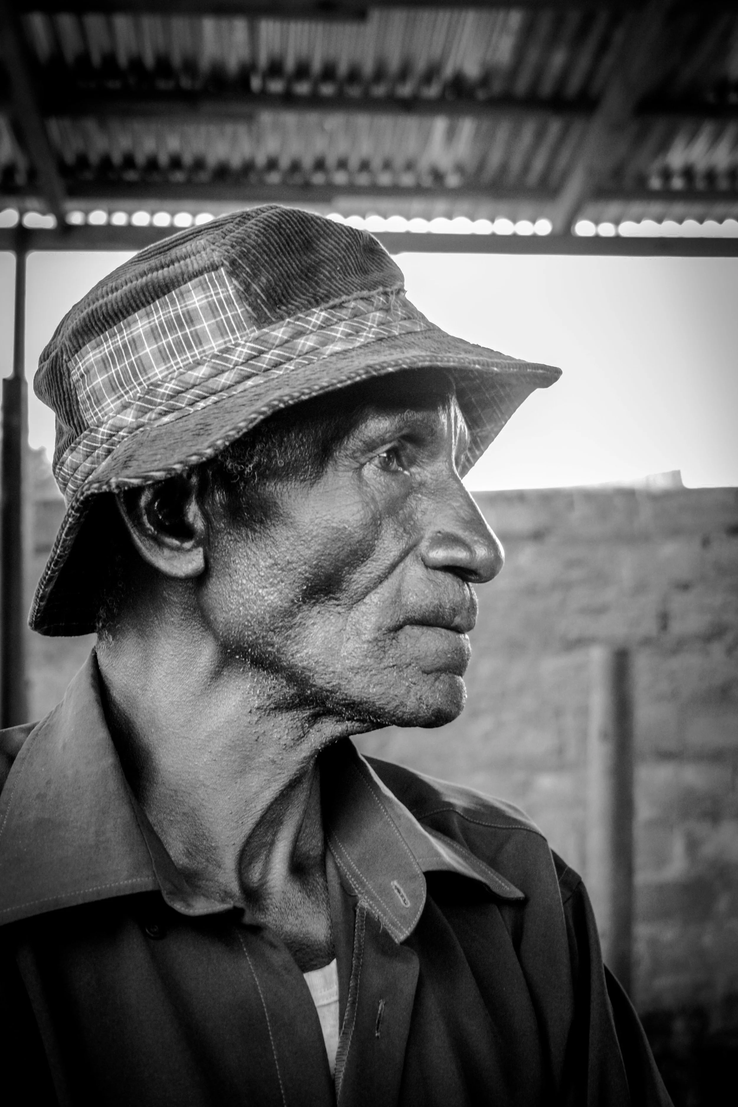 zambia 2015 | a man watching a soccer match on tv in livingstone.