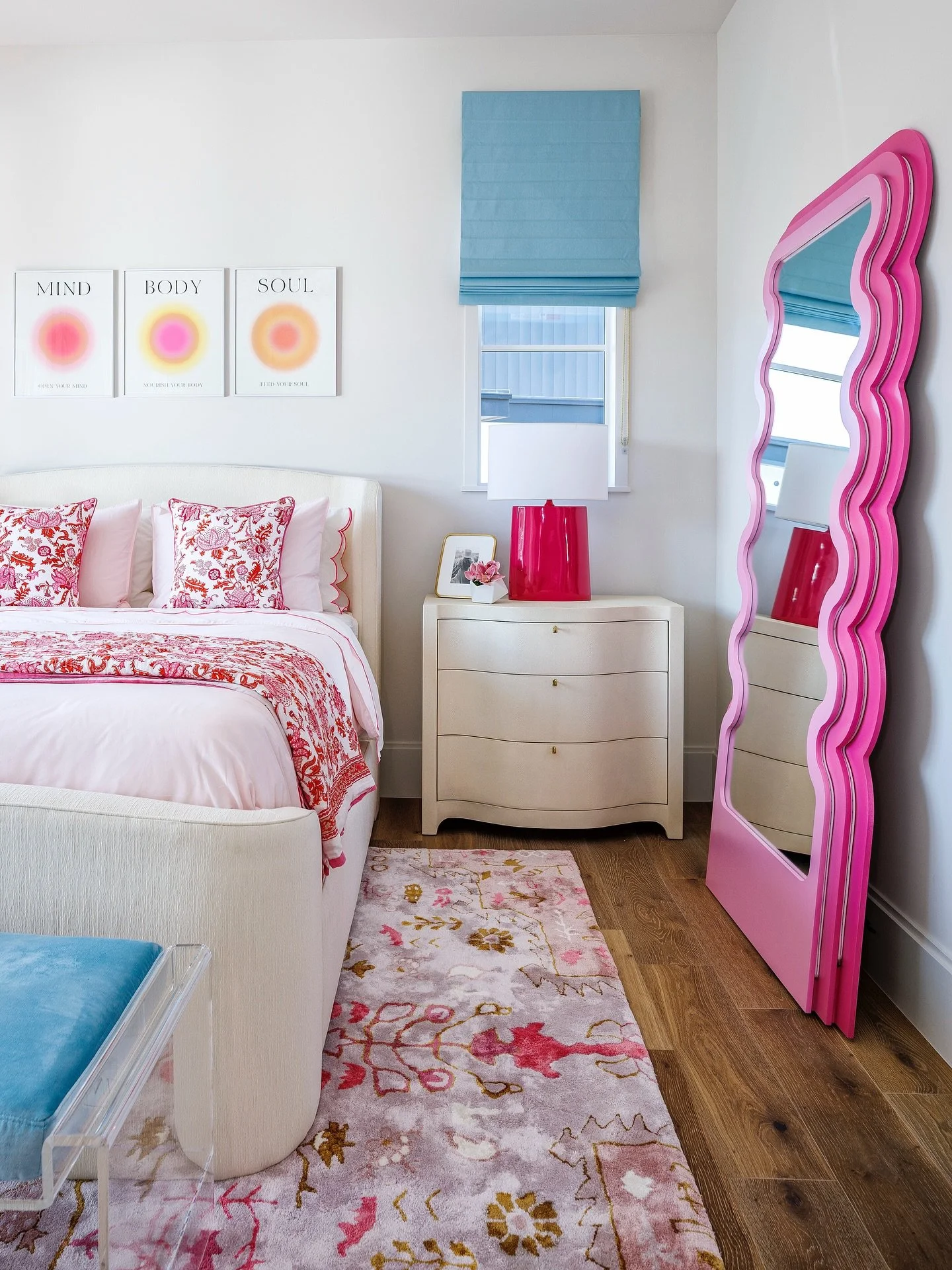 Playful, bright, and full of personality&mdash; we designed this bedroom for our client&rsquo;s daughter to grow right along with her. From the bold pink mirror to the layered pops of color and pattern, every detail was chosen to feel fresh, fun, and