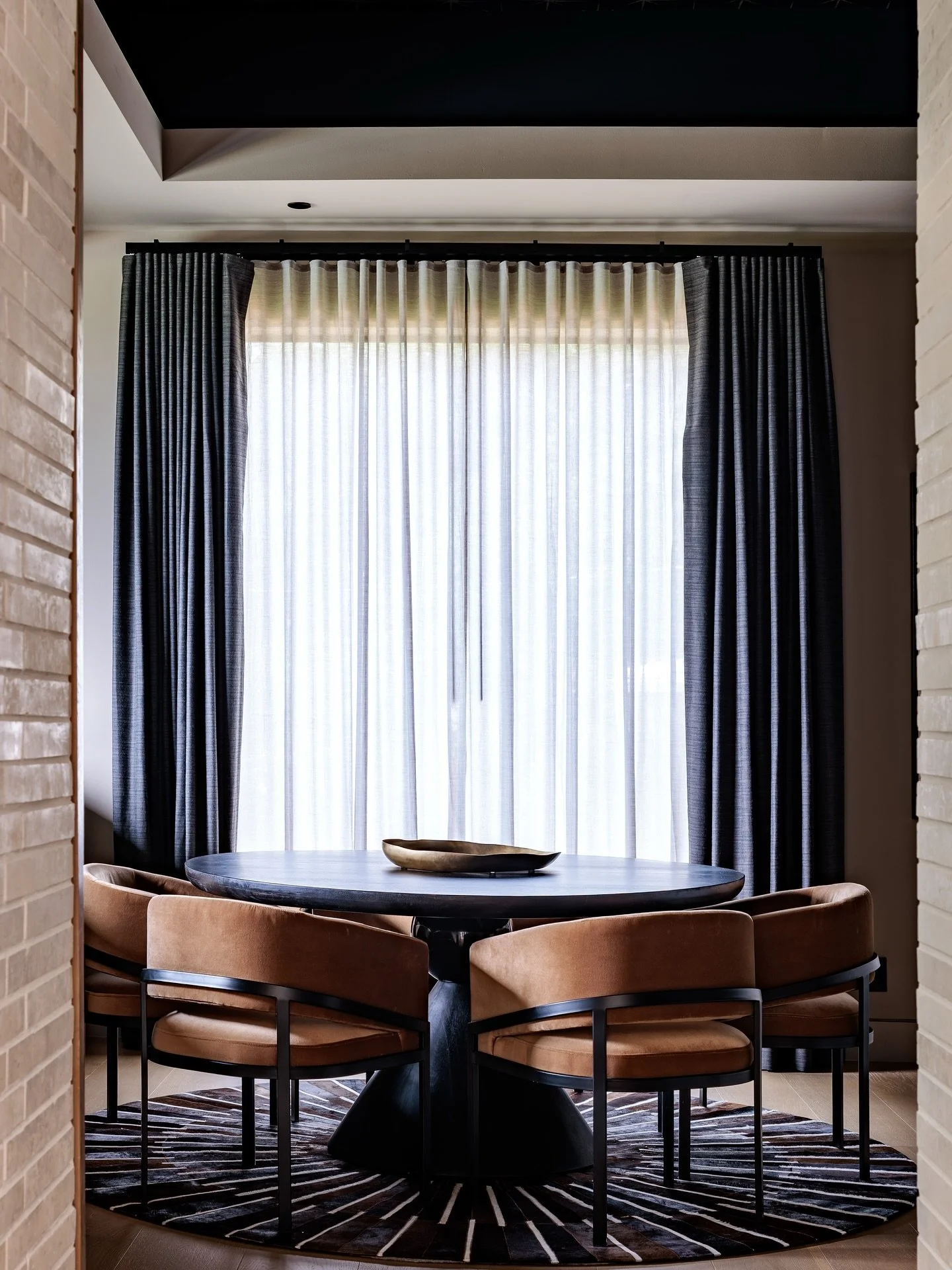 This custom-designed bar &amp; game room balances warmth and drama with layered textures, rich tones, and modern art accents.These Interior Define chairs have been beloved by several of our clients and have passed the comfort and style test with flyi
