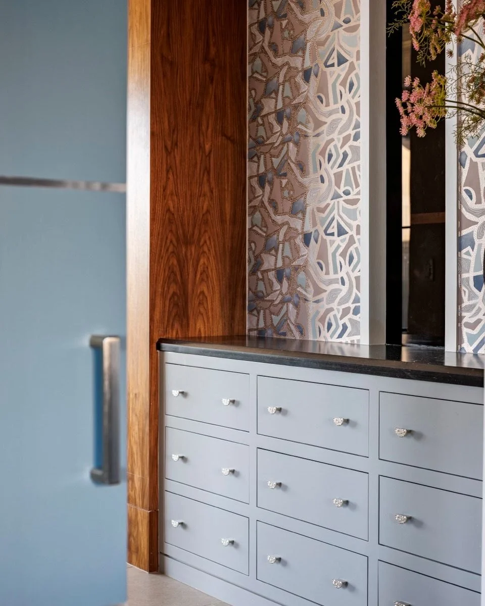 We had so much fun pairing these soft blue drawers with a bold patterned wall covering and a hing of our walnut accent wall from the Family room. Storage is a must but let&rsquo;s make it stylish! #atxinteriors #atxinteriordesign #austininteriors #au