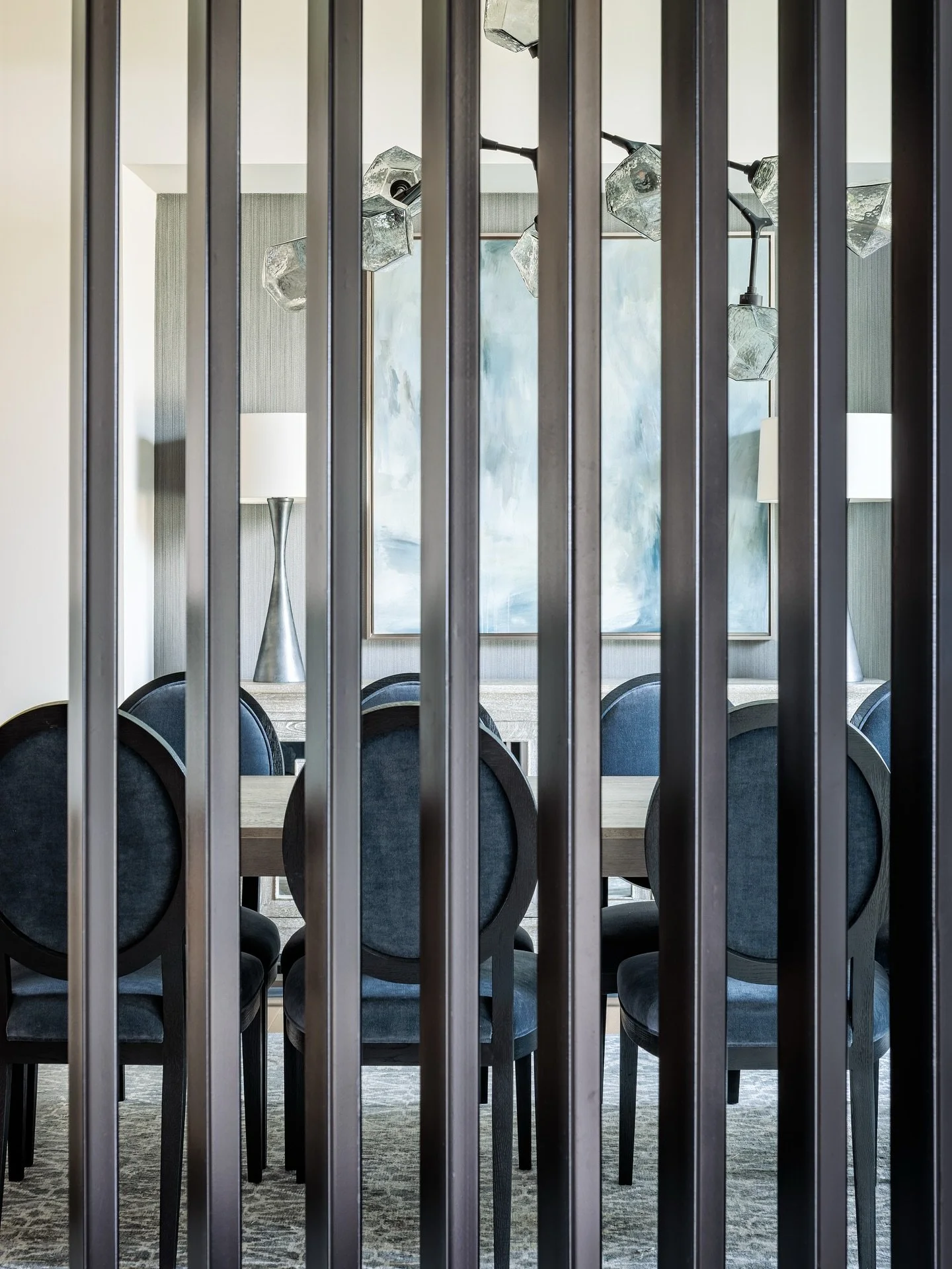 A first impression that sets the tone. This dining room, just off the entryway, was designed to feel equal parts inviting and dramatic. Custom ironwork, bold art, and statement lighting create a space that&rsquo;s perfect for unforgettable gatherings
