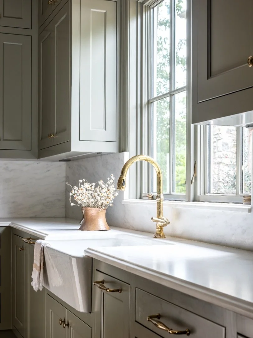 We absolutely love the kitchen space in our Central Austin project. We paired classic cabinetry with marble countertops and splash and a polished brass faucet that catches the light just right. Plus, we love to mix metals with this antique copper pot
