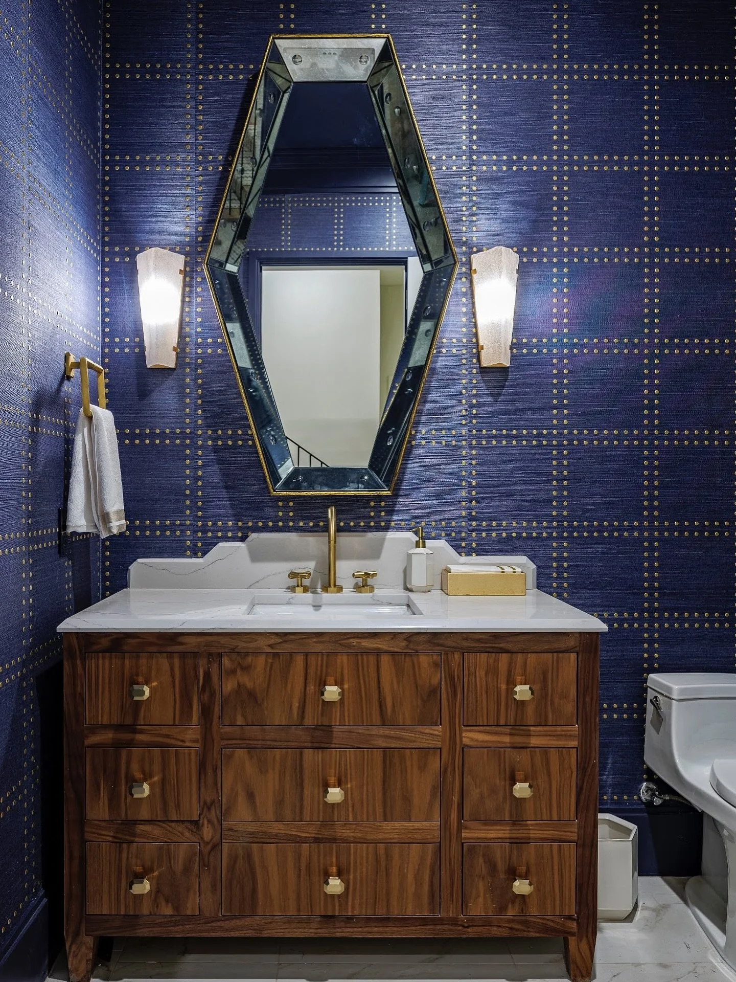 Bold riveted walls, warm walnuts, and a mirror that steals the show ✨ Elevating this powder bath with major personality. #StatementSpace #PowderRoomGoals #BrassDetails #interiordesign #austininteriors #atxinteriordesigner