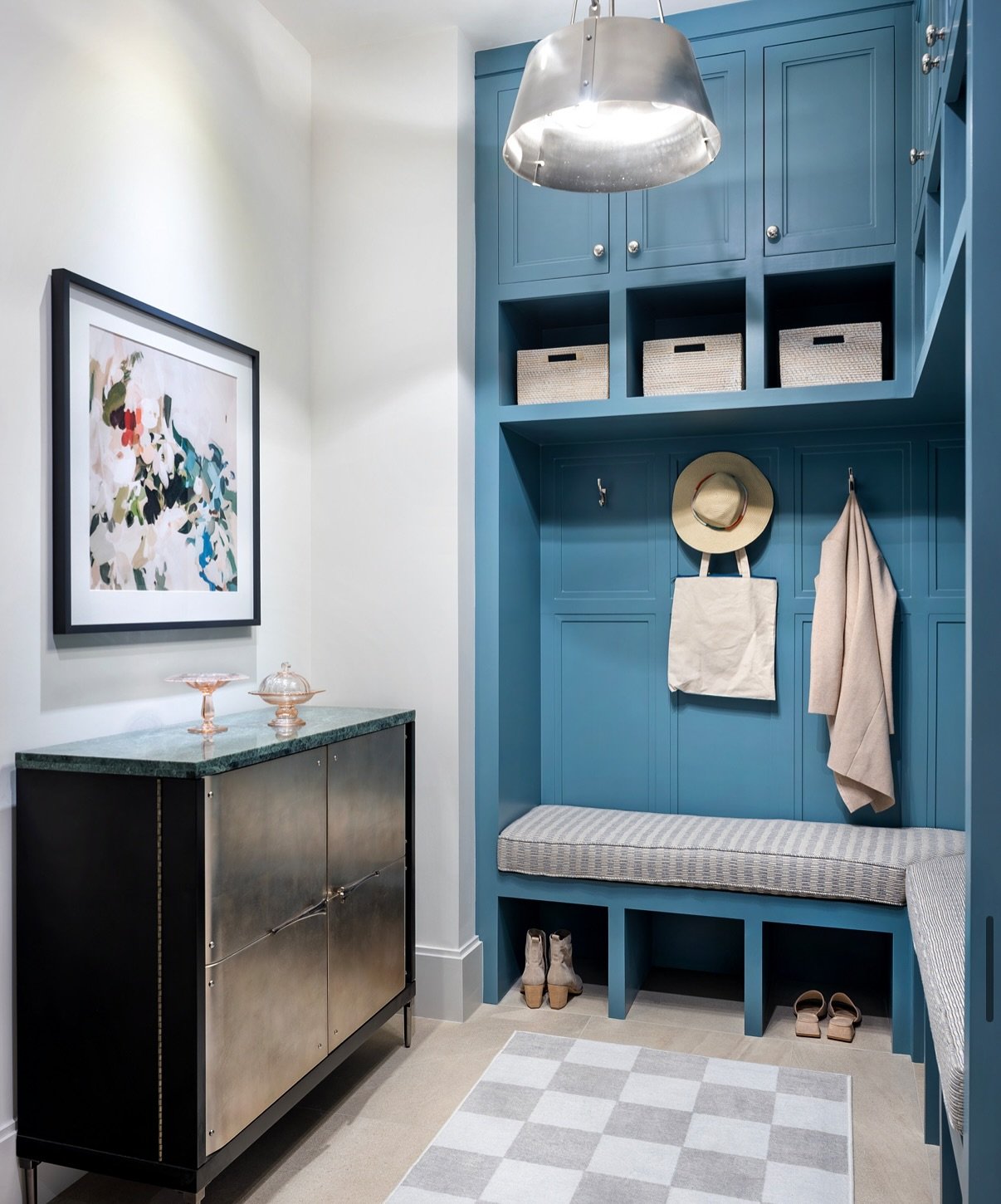 A mudroom we designed was recently featured on @houzz - For this room, our clients wanted a space that not only served its practical purpose but also reflected their vibrant personalities. By introducing well-planned built-ins, thoughtful storage sol