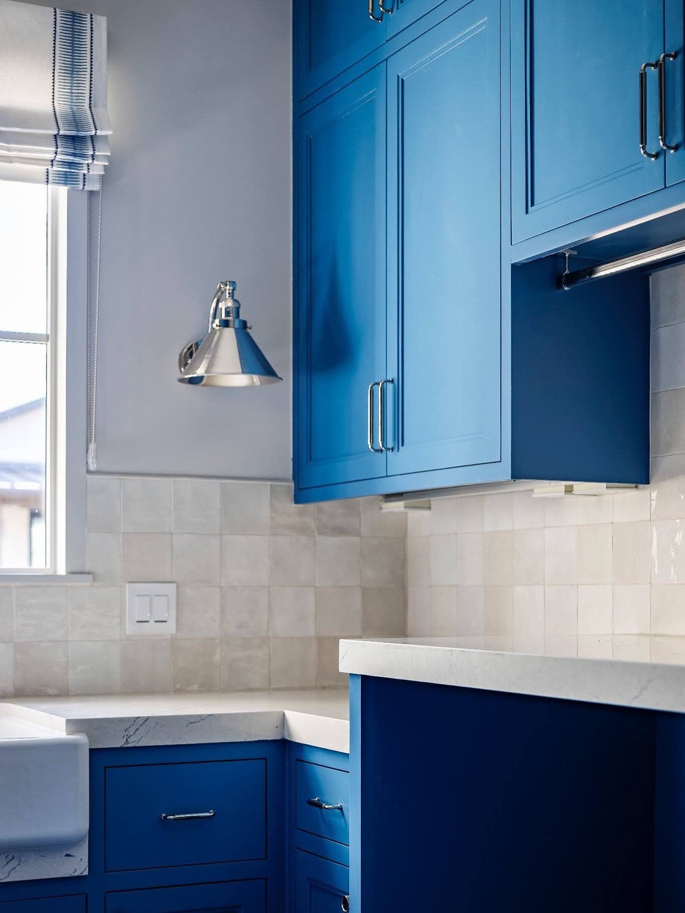 What do yall think of these bold blue cabinets and patterned tile in our client&rsquo;s laundry room?
Paired with flash ivory from arizona tile and a fun striped roman shade from The Shade Store.
Shade Fabric - Alexa Hampton 
Paint: Inky Blue by Sher