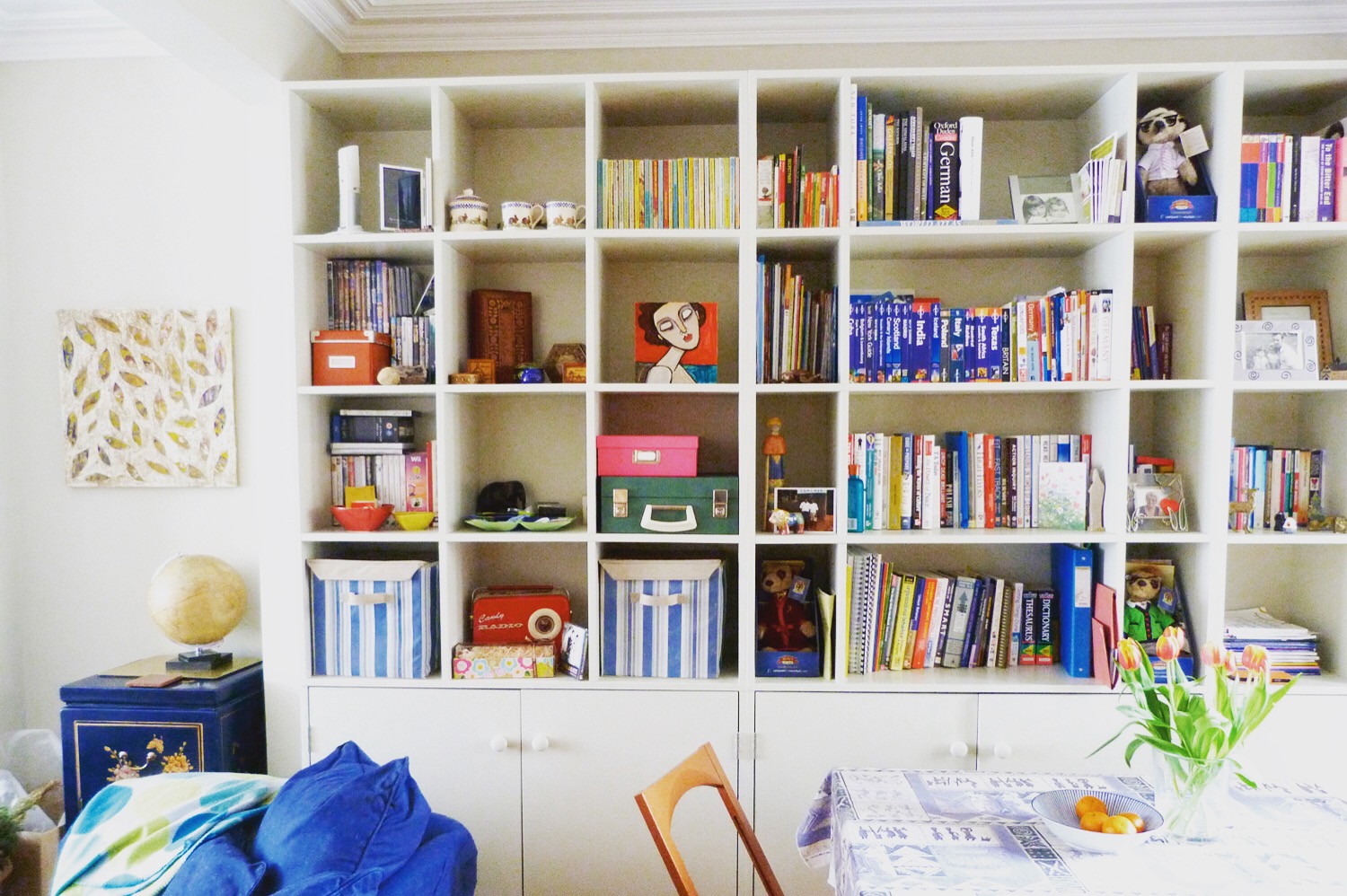 Bookshelves and display shelving - full width box shelving with low-level cabinets painted finish to match decor.