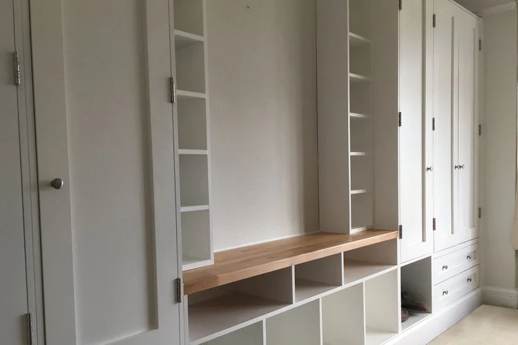 Floor to ceiling bespoke fitted wardrobes.