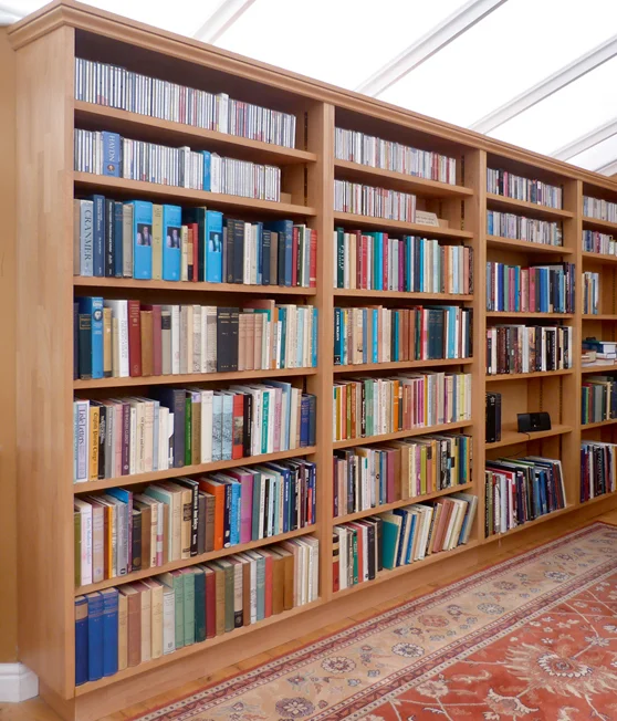 A large bespoke bookcase made out of beech with adjustable shelf heights.