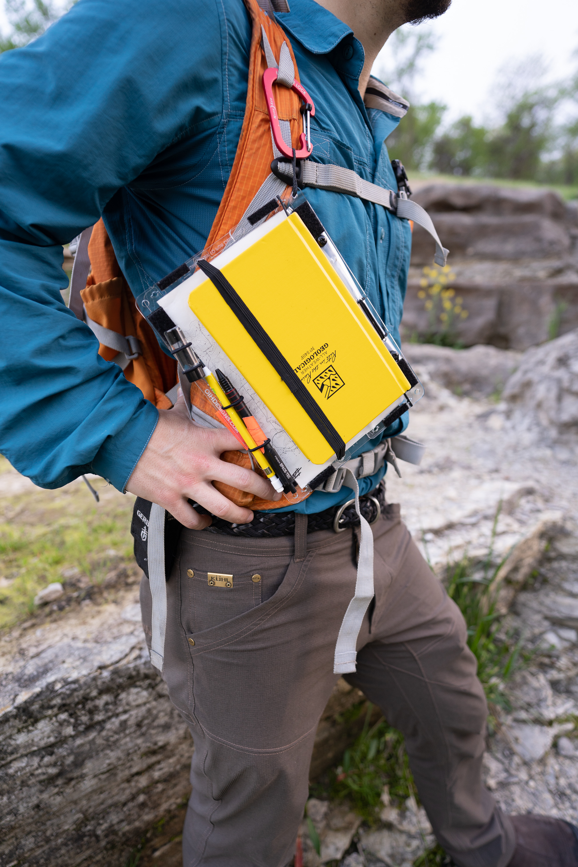 Attaches to a backpack with a carabiner.