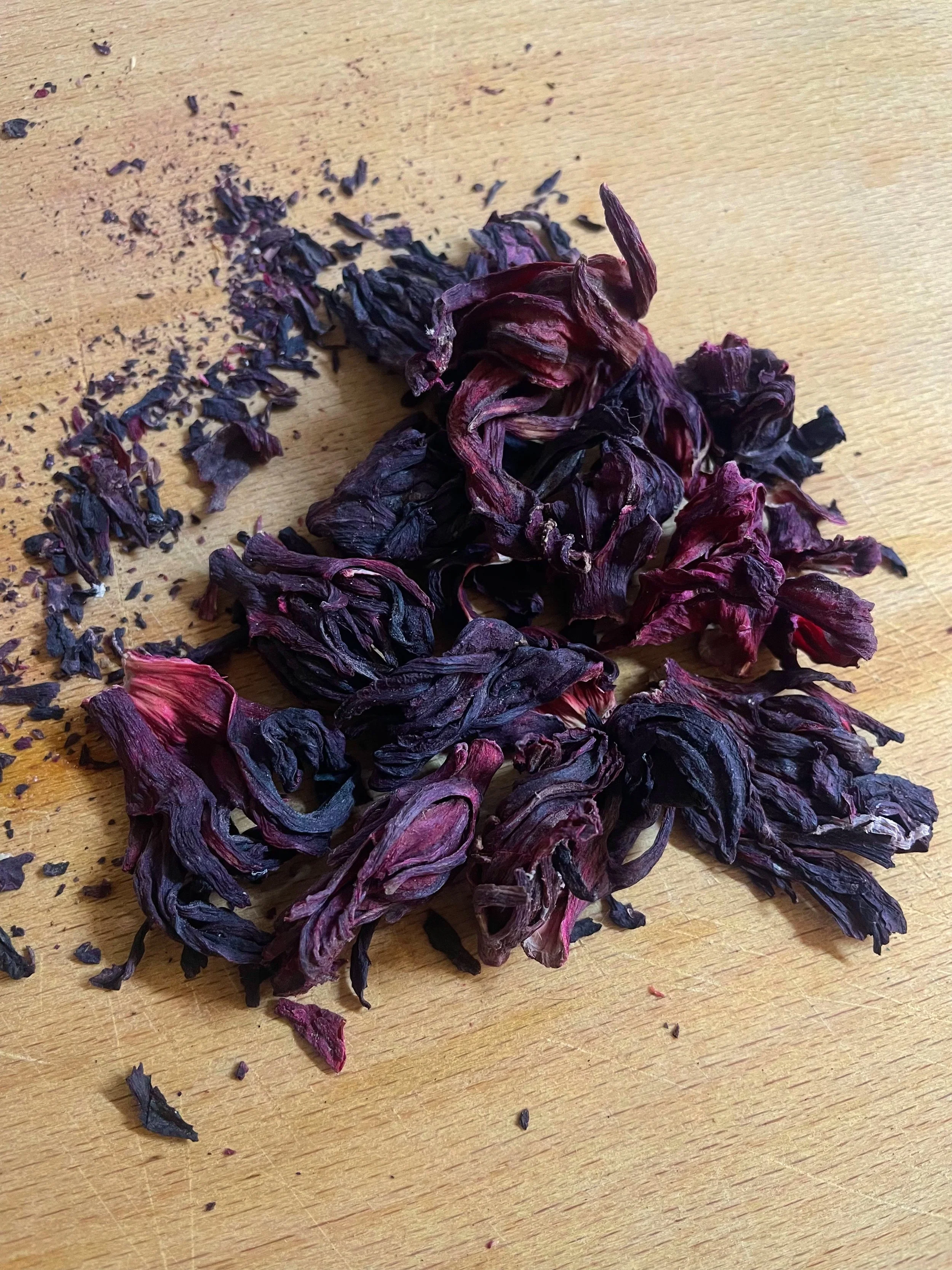 A pile of hibiscus on a chopping board from visual artist Harri Harrison's grief commissions
