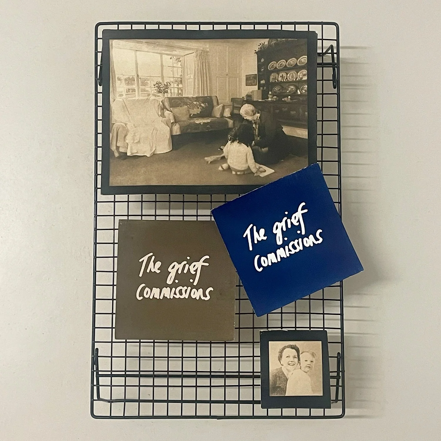 Examples of cyanotypes on a drying rack - from visual artist Harri Harrison's Grief Commissions
