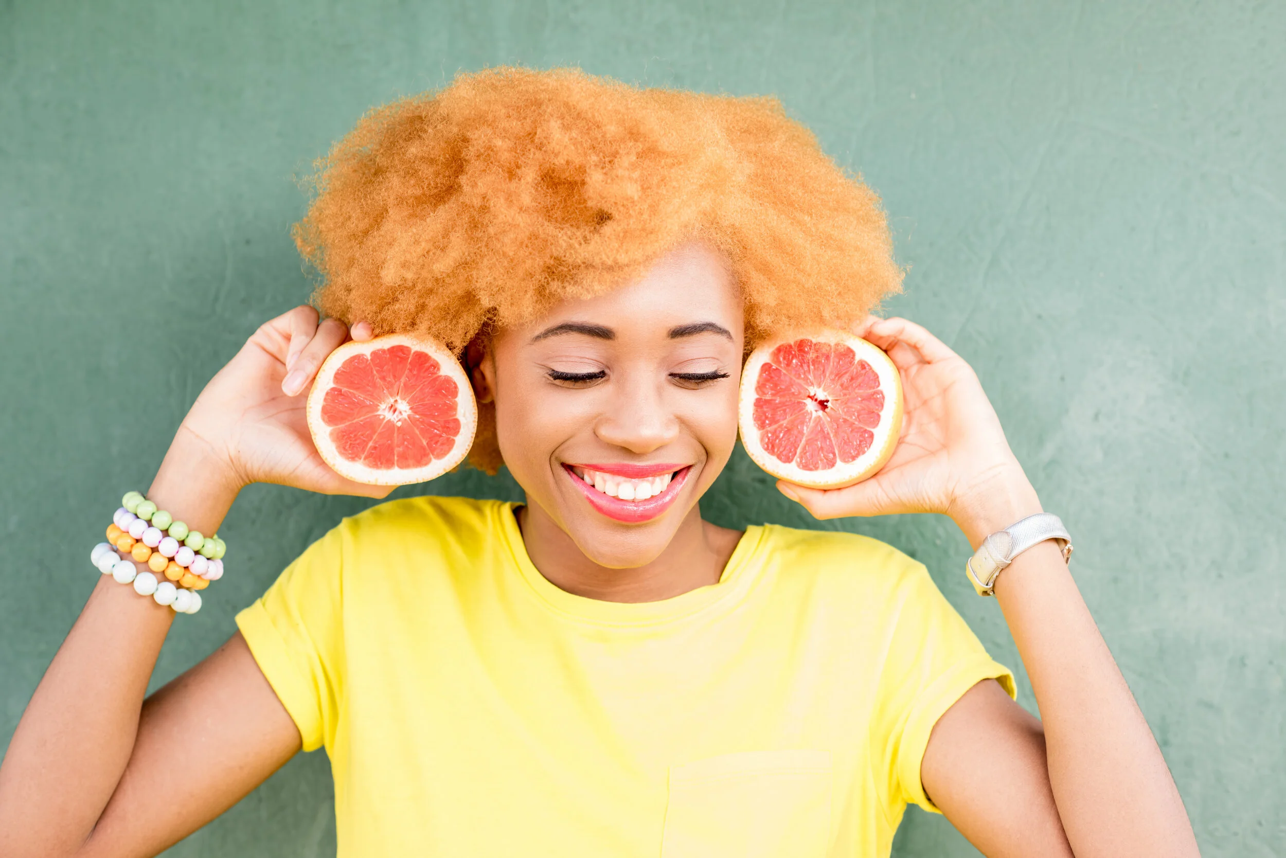 Canva - African Woman with Grapefruit.jpg