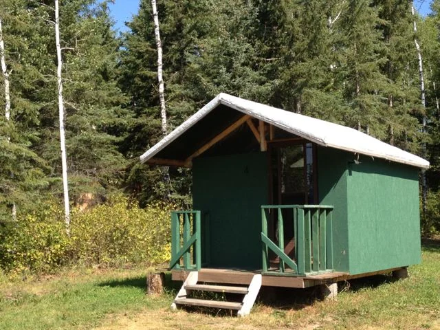 Canvas Cottages (4 available) Enjoy Electric Sky in comfort. These rustic canvas cottages are sure to bring back memories of summer camp! With two single bunk beds, capacity is 4 people. Linens and VIP access are included. $138/person if at capacity - entire cabin rents for $550