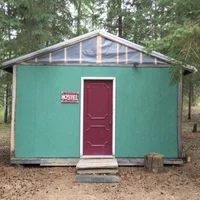 The Hostel Enjoy Electric Sky in comfort. This rustic canvas cottage is sure to bring back memories of summer camp! With four single bunk beds, capacity is 8 people. Linens and VIP access are included. $138/person if at capacity - entire cabin rents for $1100