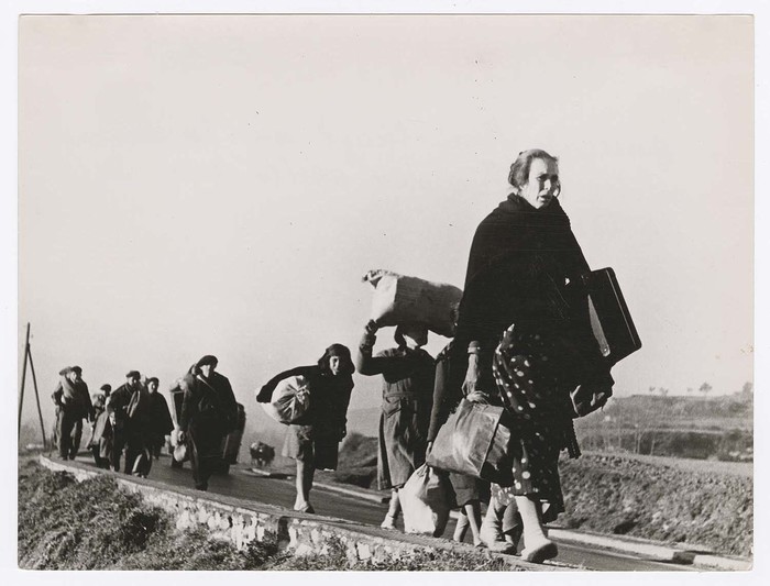 Refugees walking on the road from Barcelona at the French border, Spain
