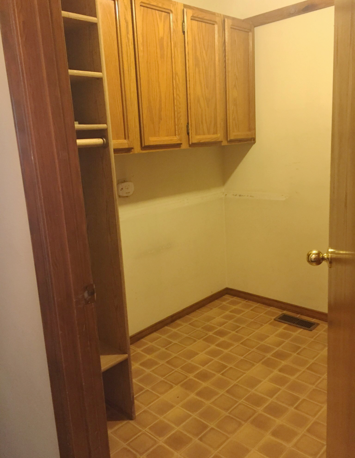 Laundry room to Garage. Both the laundry door and the door to the garage swung into the room which made it difficult to get to the washer and dryer.