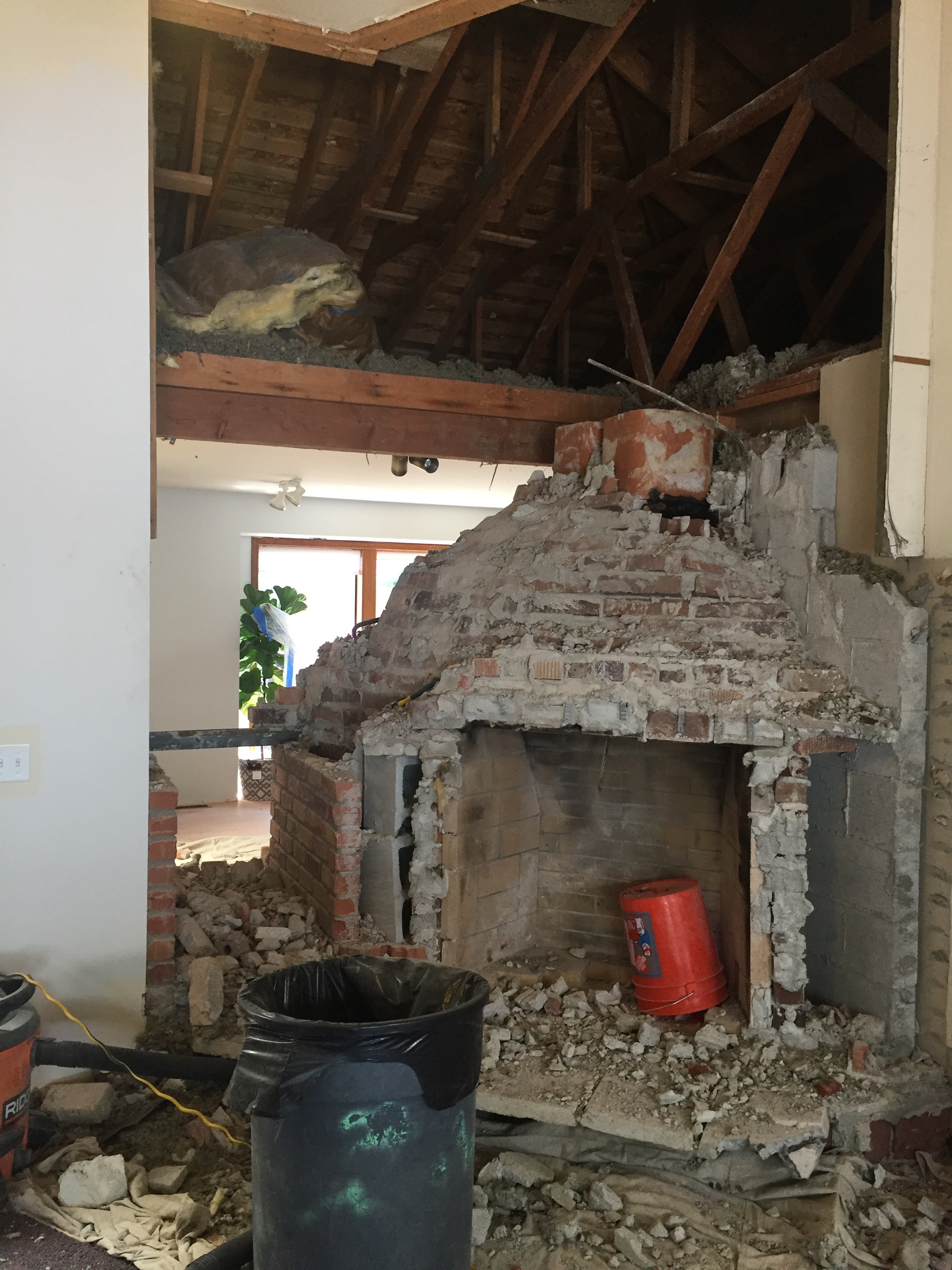 My husband first started chiseling away at it then we realized how big a job this was going to be. To remove the fireplaces, it took two guys with a roto hammer, 2 full 8 hour plus days to get it all out! Seeing the other room made me excited!