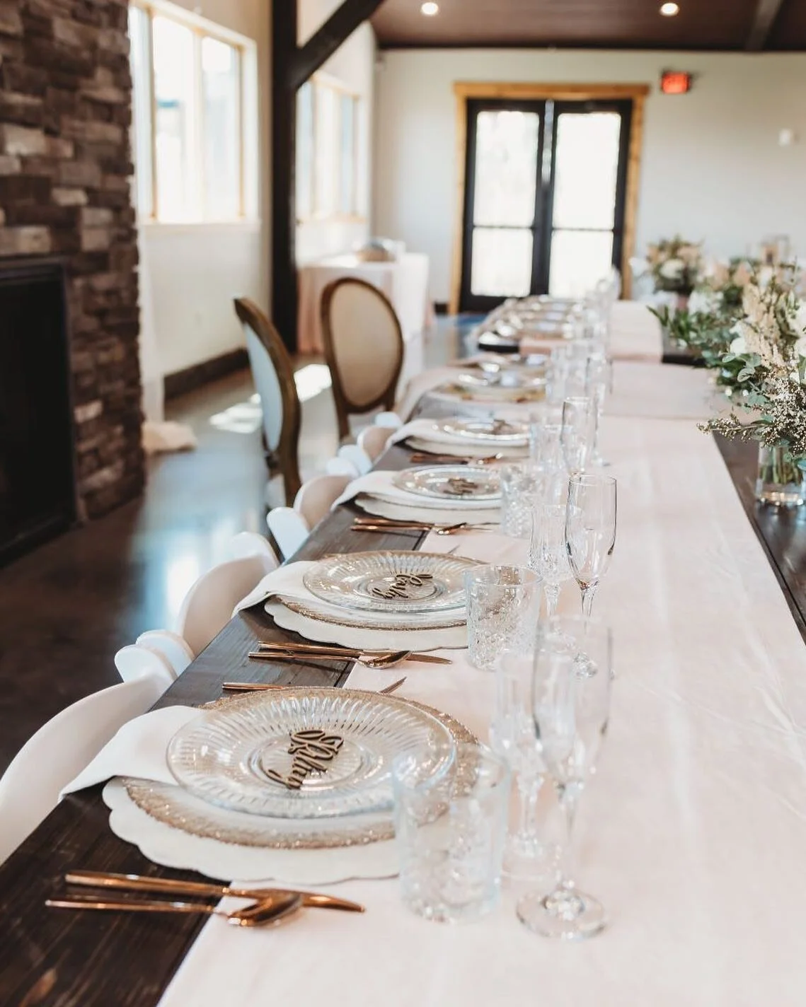 Soft, subtle, & sophisticated. 
.
Mother of pearl charger with glass embellished edge charger for a layered look, glass top plate, clear & crystal glassware and copper flatware paired for a classy look! 
.
@amberreneephotographer