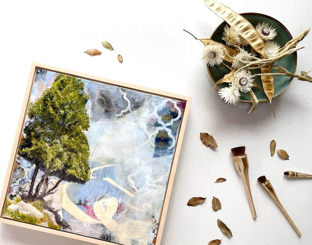 Unveiling Truth, framed mixed media painting on panel from the Hu Collection, 2021, with a tree, gold and navy geometric tile patterns and the word "Hu" partially visible in calligraphy, styled in a flatlay with dried flowers and paintbrushes