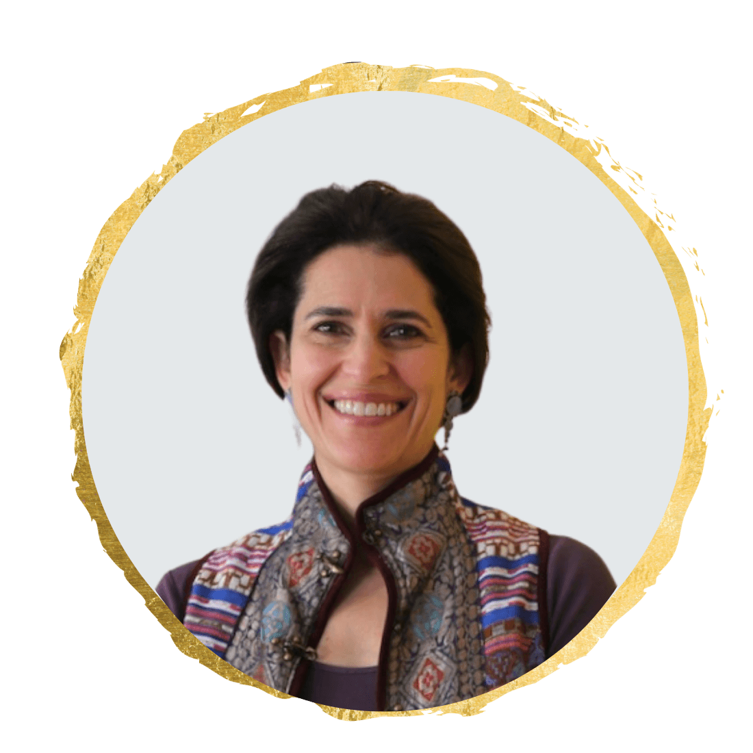 Sara Kabariti, smiling in a patterned gilet, framed in a gold circle