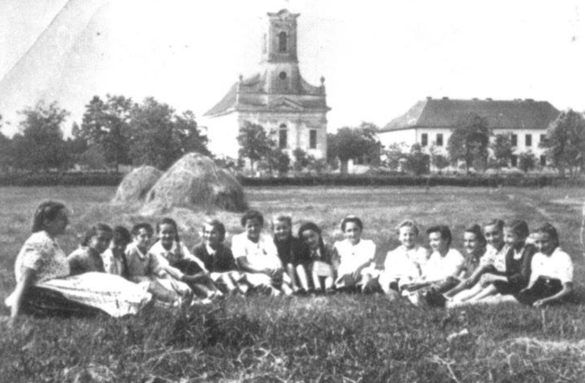 Group of “aunties” in front of St. Leopold’s Kirche (Jabuka, Serbia) early 1940s. This church has been reproduced in our stairway painting by friend Lorrie Quimby, a fellow Yamhill County BB Innkeeper. 