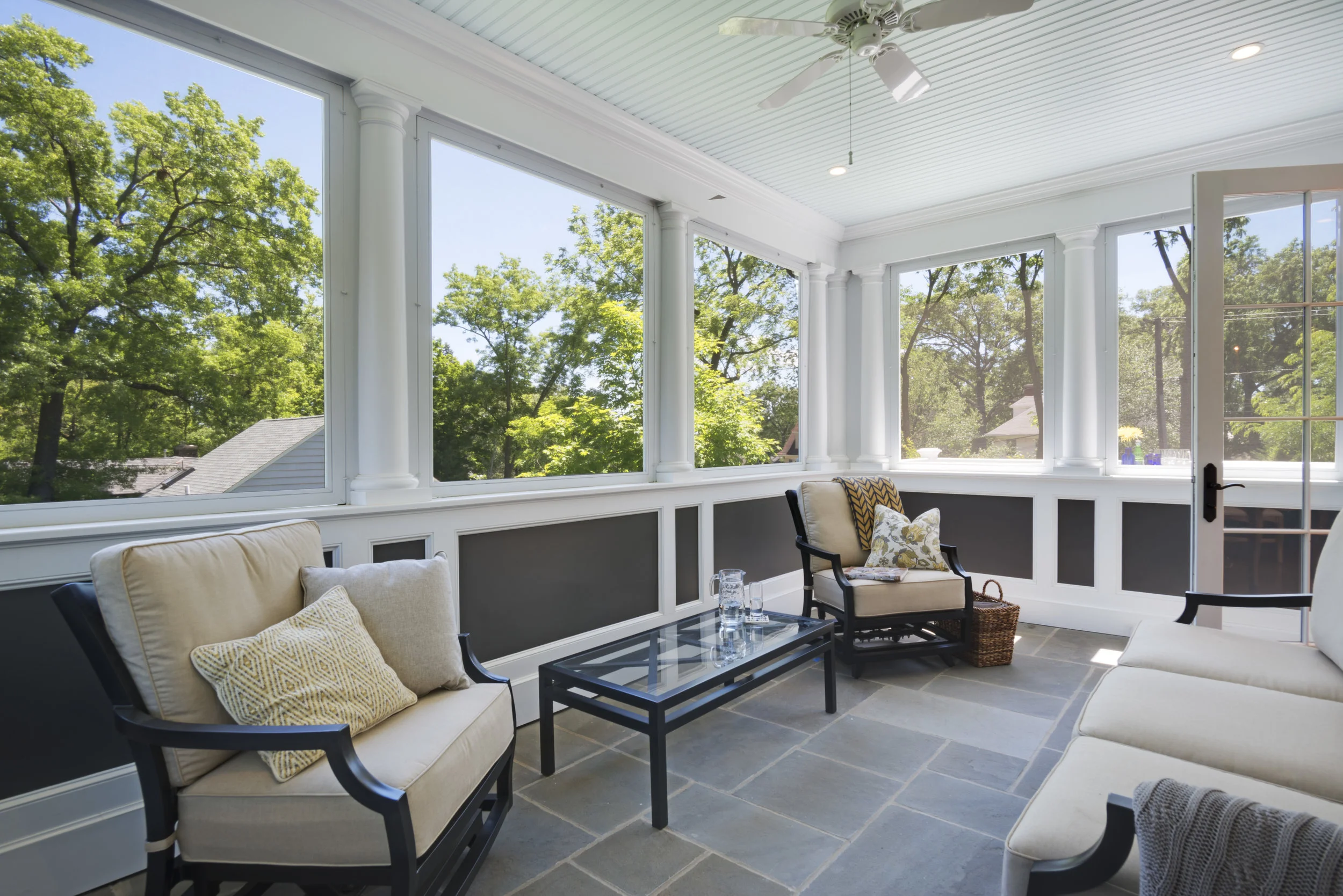 And a Screened porch has views of the tree tops and the church bell tower. This home is just a block from town on a busy, sloping, corner lot. The elevated porch with low wall offers privacy from the passers by on the street level. Exposed on three sides, the rustling of the the leaves in the breeze makes you feel like you are in a tree house.
