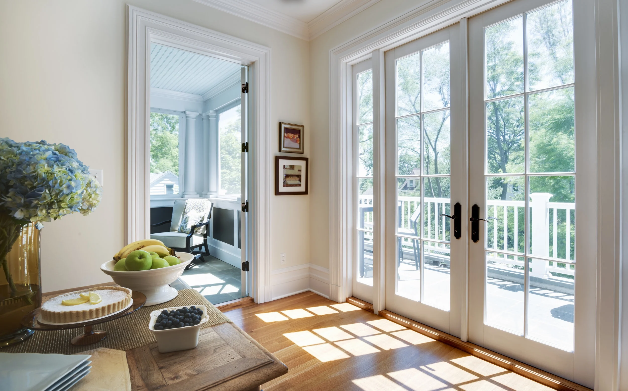 Casual Dining off the renovated kitchen with access to the terrace and screened porch. Natural light pours in.