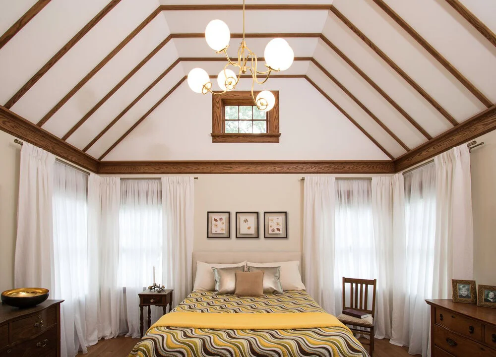 The Master Suite features soaring ceilings and six windows in all. With view of the sun rise in the morning and moon in the evening. The natural wood trim is consistent with the existing trim details in the rest of the home.