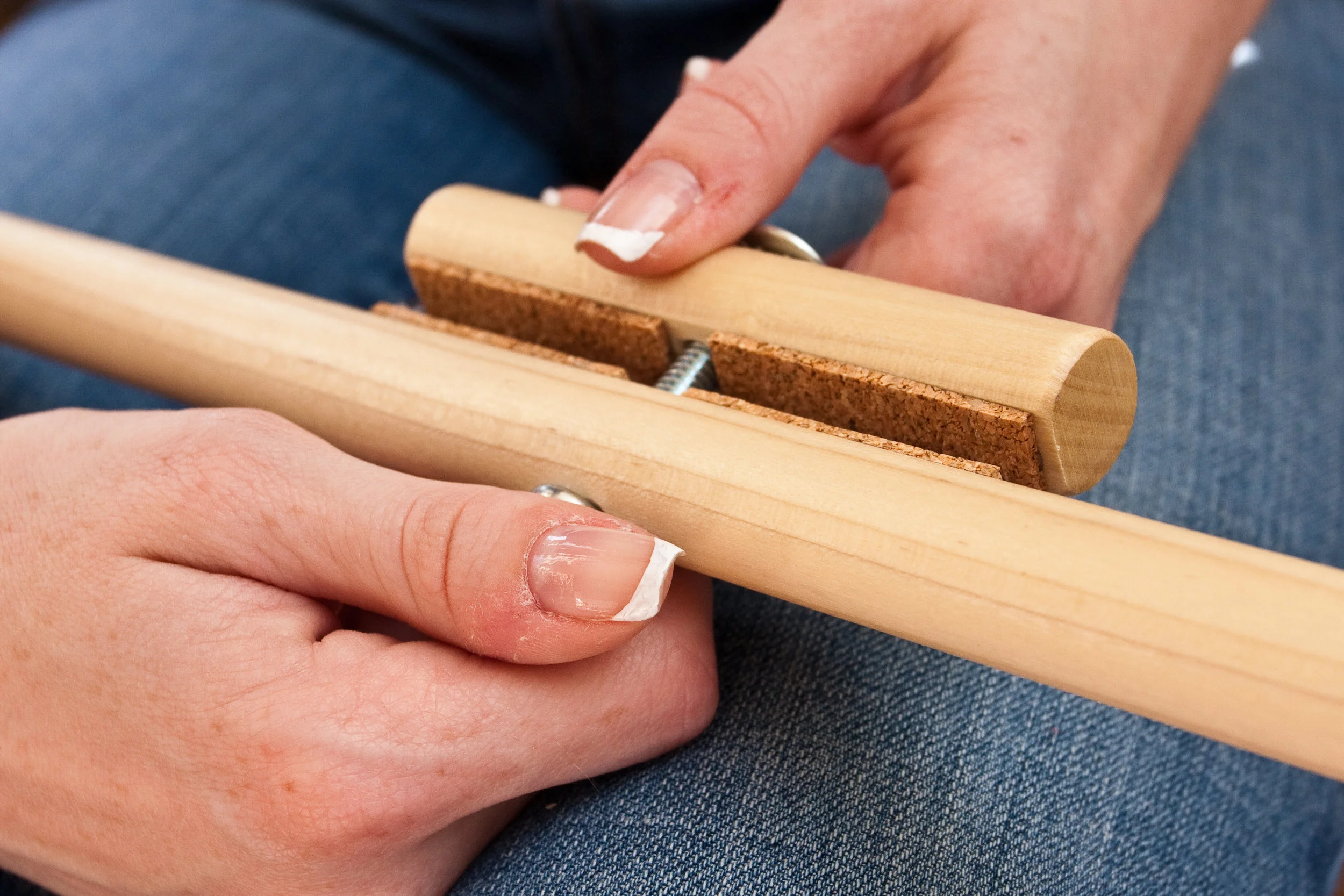 Step 1 - loosen the wing nut to create space between the foot and the body of the Harp Stick.