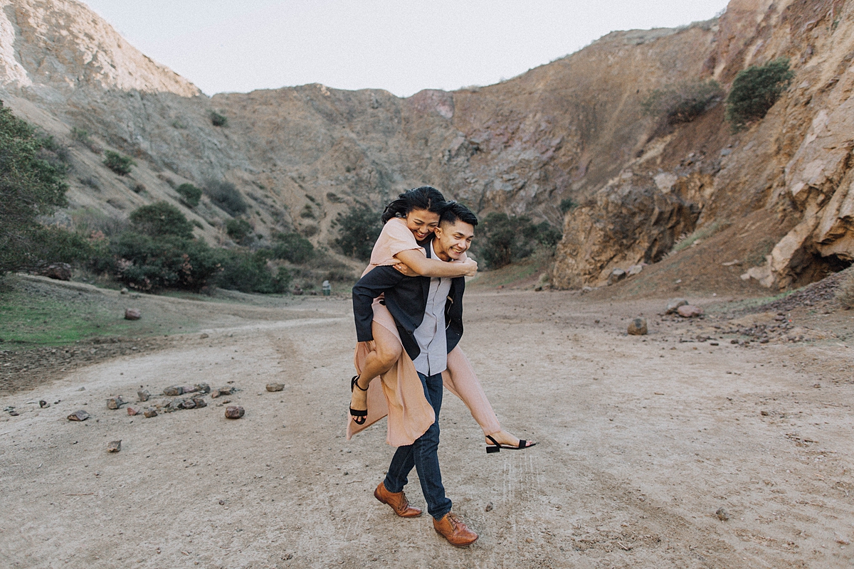 Los Angeles Romantic Outdoor Engagement Photos in the Mountains, candid engagement photos, piggyback ride engagement photos
