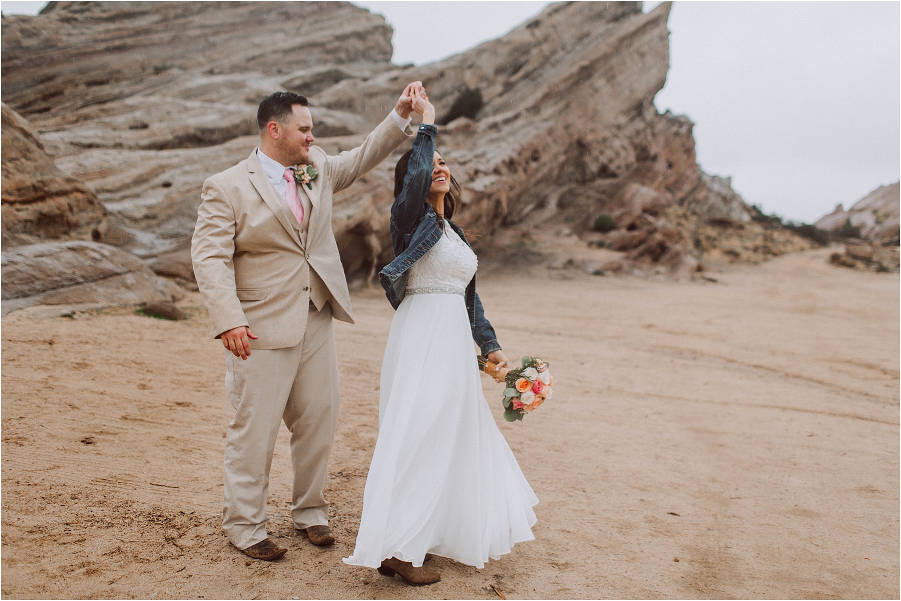 Vasquez Rocks Intimate Wedding & Elopement Photography - Bride & Groom Portraits dancing in the rain