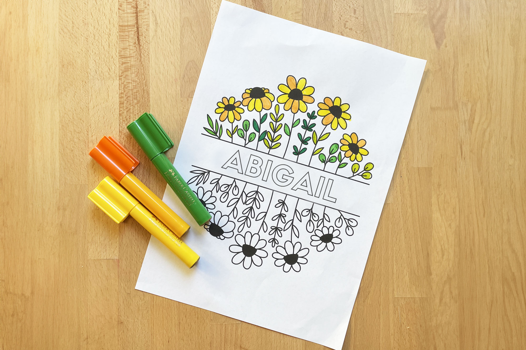 coloring sheet customized to the name Abigail with flowers.