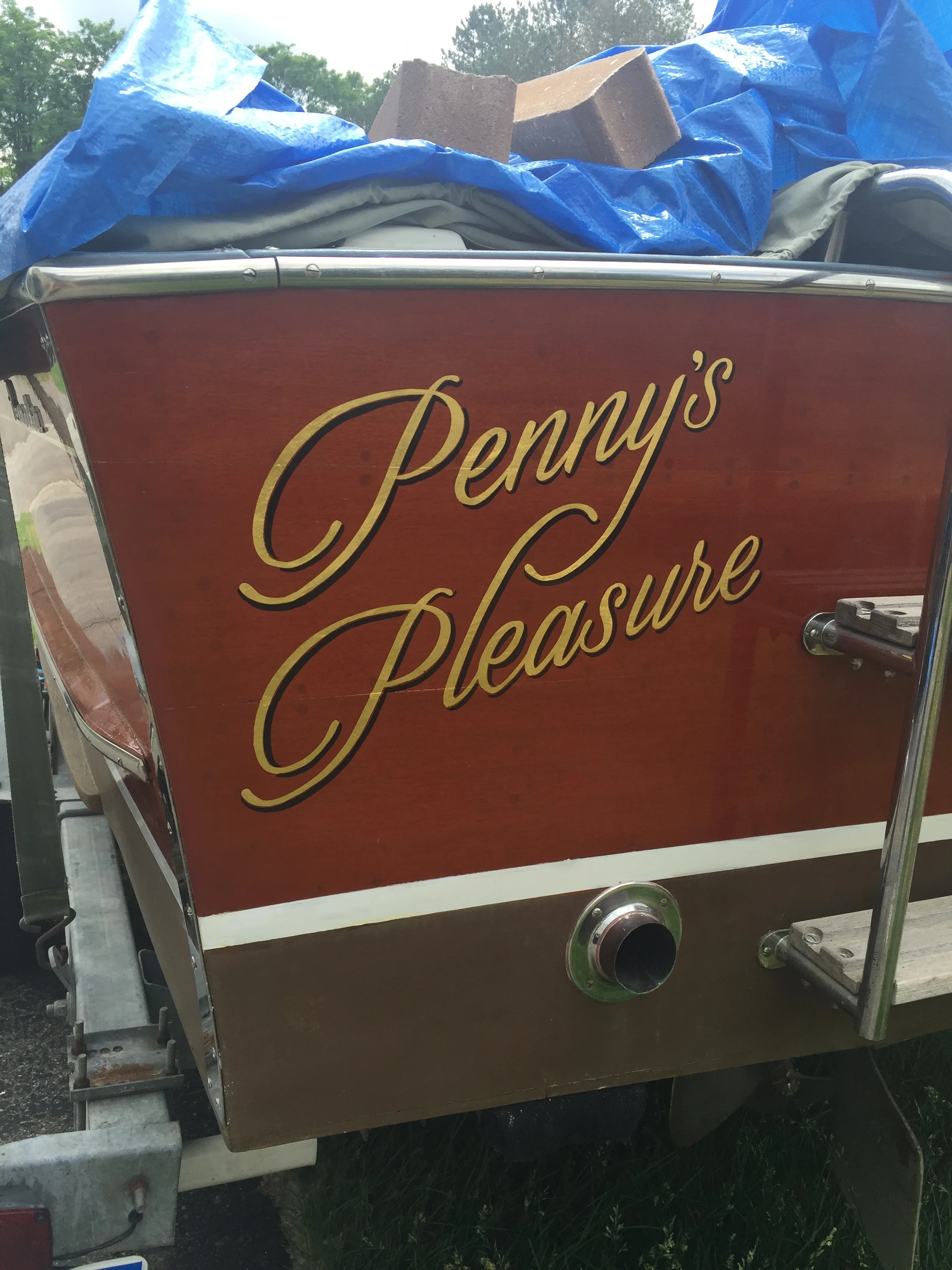 23k gold on a mahogany boat transom