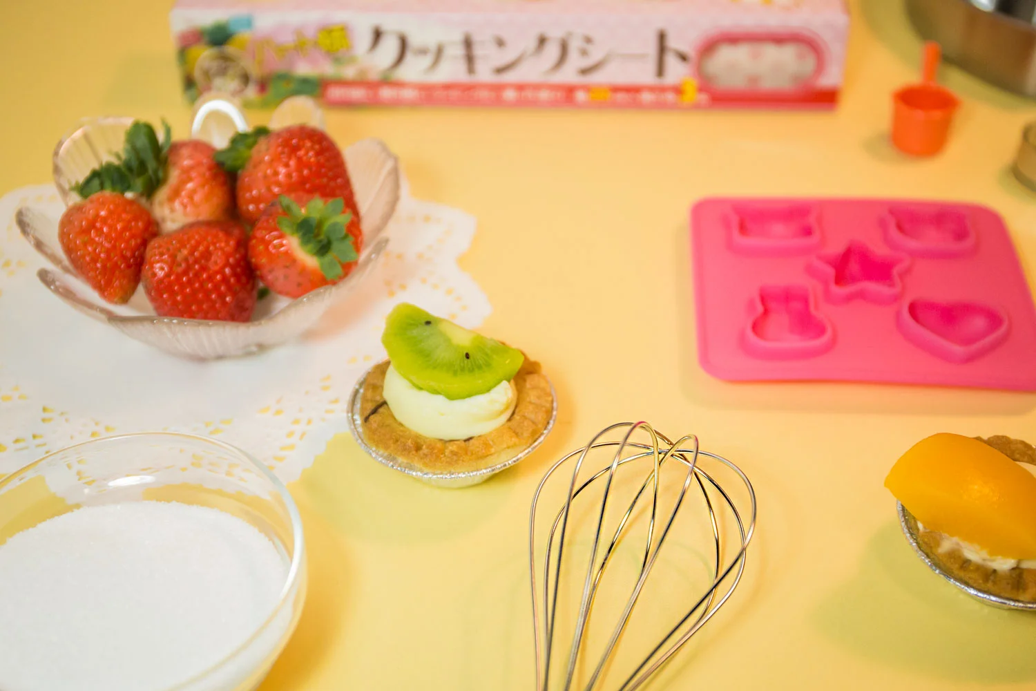 Products shown: mold, parchment paper, bowls, whisk