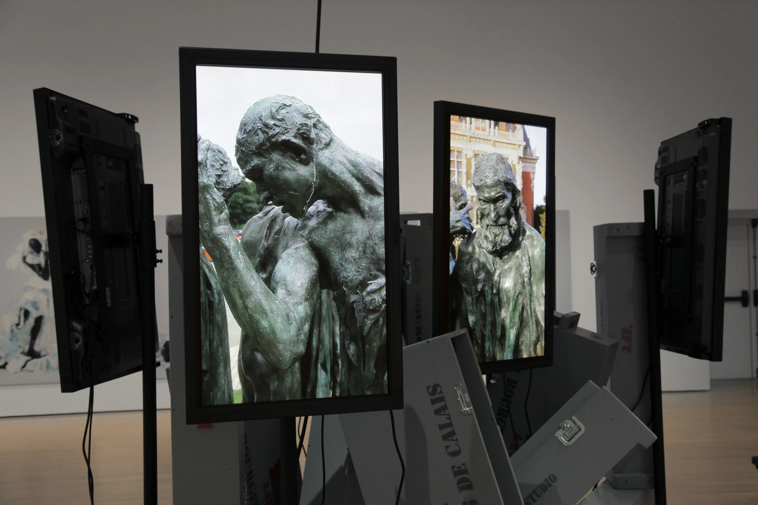 Les Bourgeois de Calais: Crated and Displaced 2010, 7 HD Videos, 7 42" plasma screens, 7 crates, other materials Installed at the Musée d'Art Contemporain de Montréal