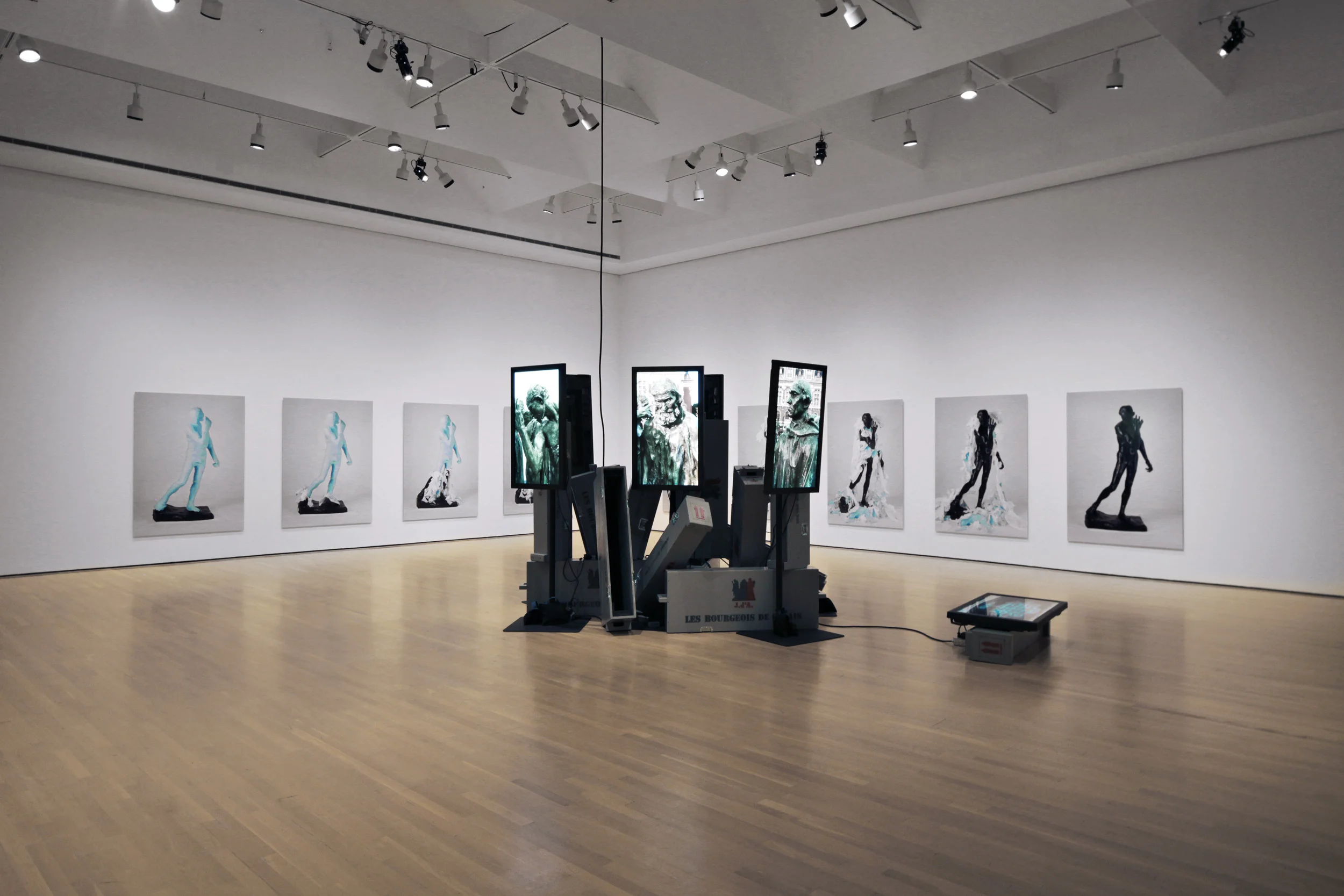 Les Bourgeois de Calais: Crated and Displaced 2010, 7 HD Videos, 7 42" plasma screens, 7 crates, other materials Installed at the Musée d'Art Contemporain de Montréal